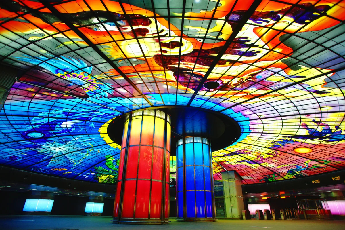 Brilliant stained-glass colors above the Dome of Light concourse