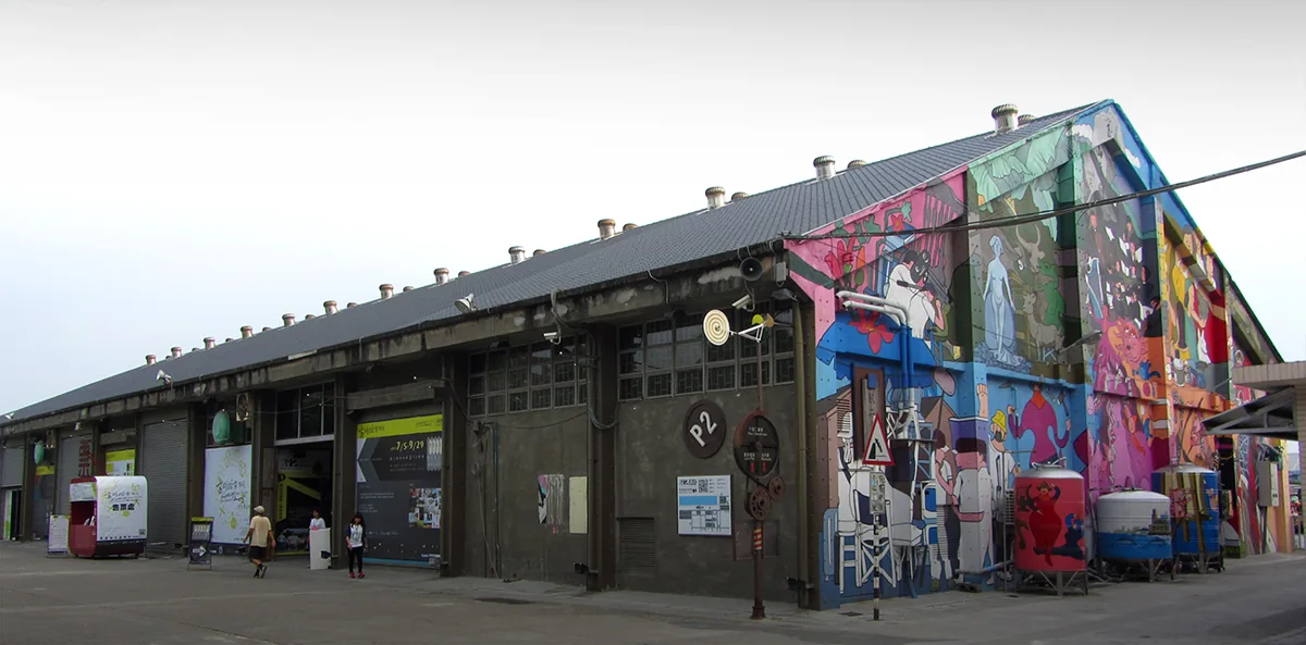 Colorful murals across the former harbor warehouses at Pier-2